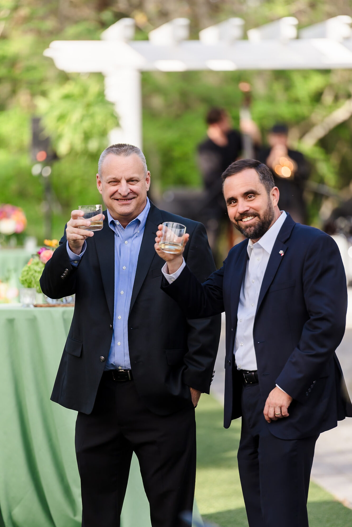 Two guests celebrating together at an event