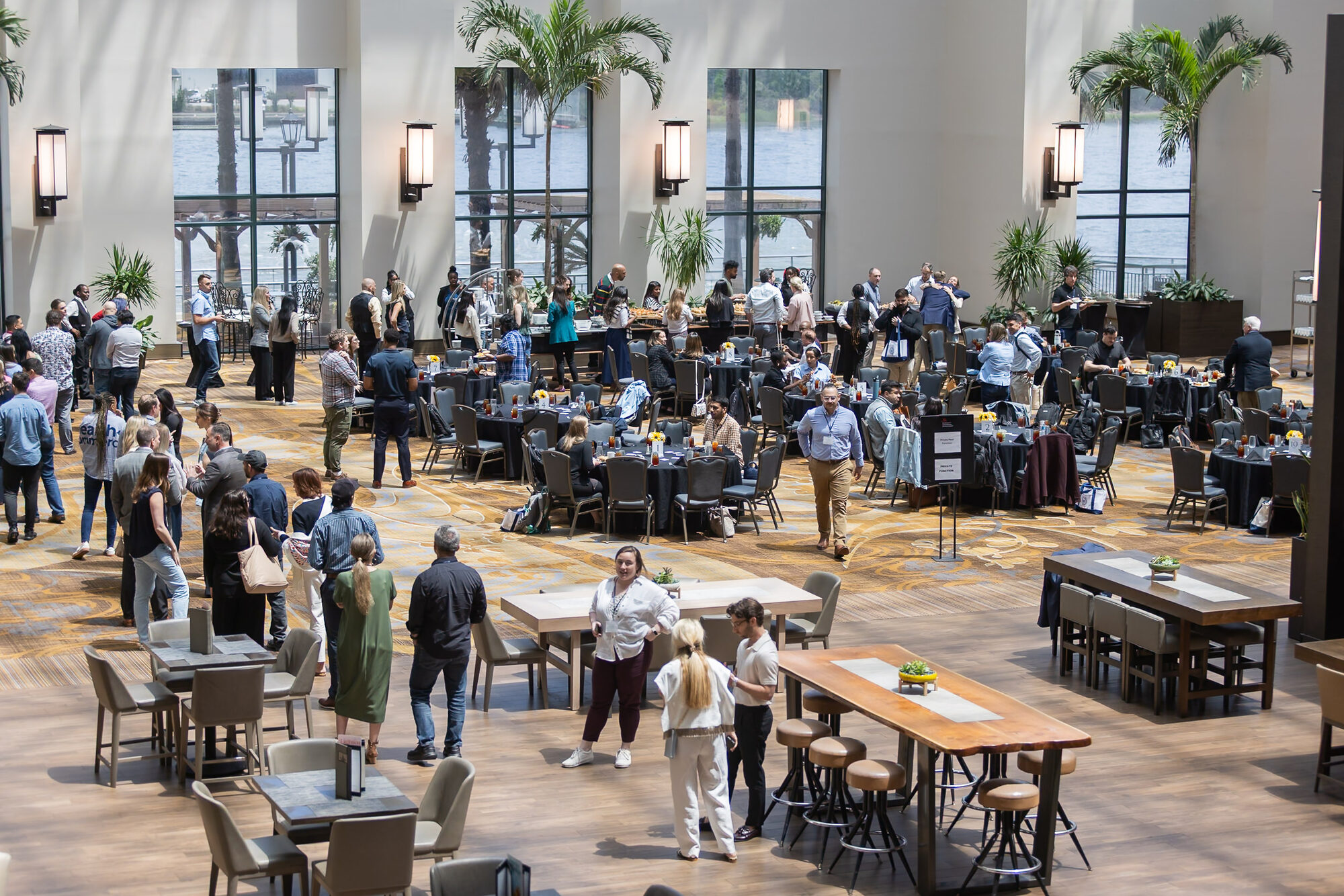 Guests connecting in a bright event space