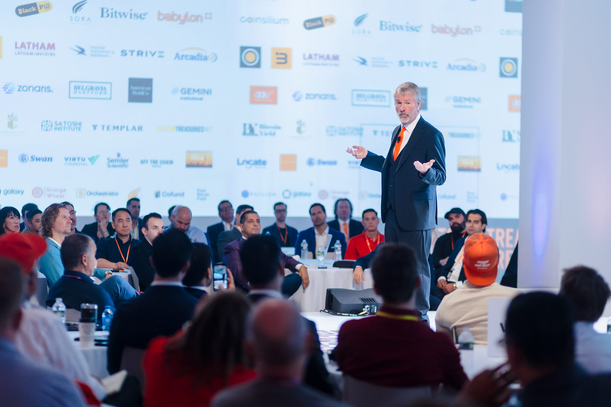 Speaker addressing a room of conference attendees