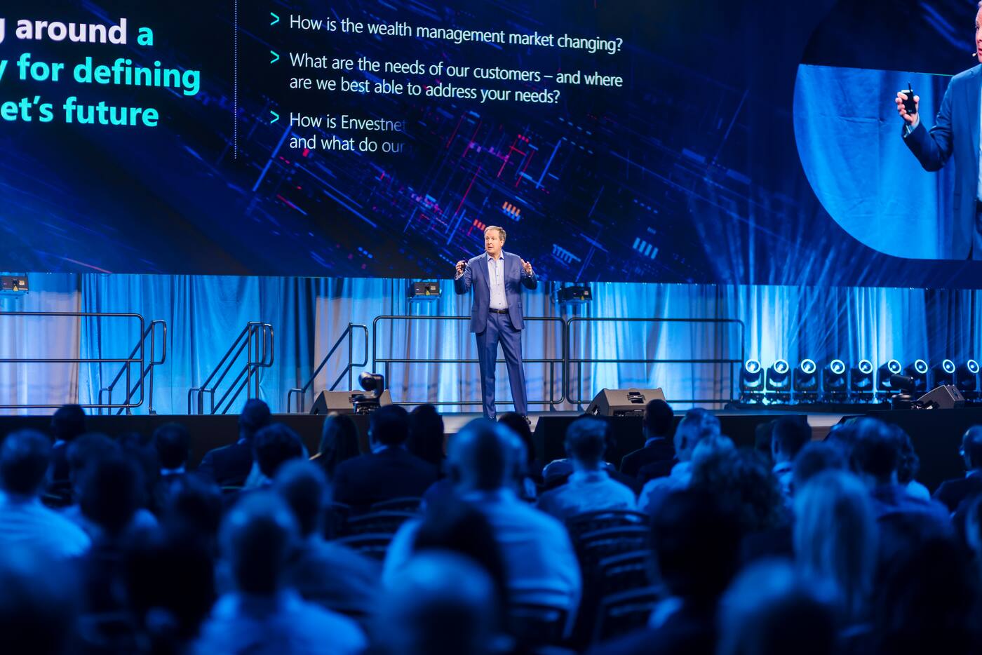 Presenter speaking on the main stage