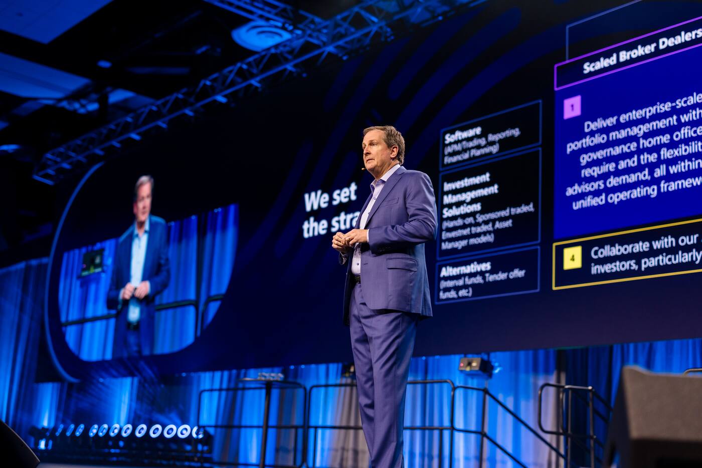 Presenter explaining a topic on stage