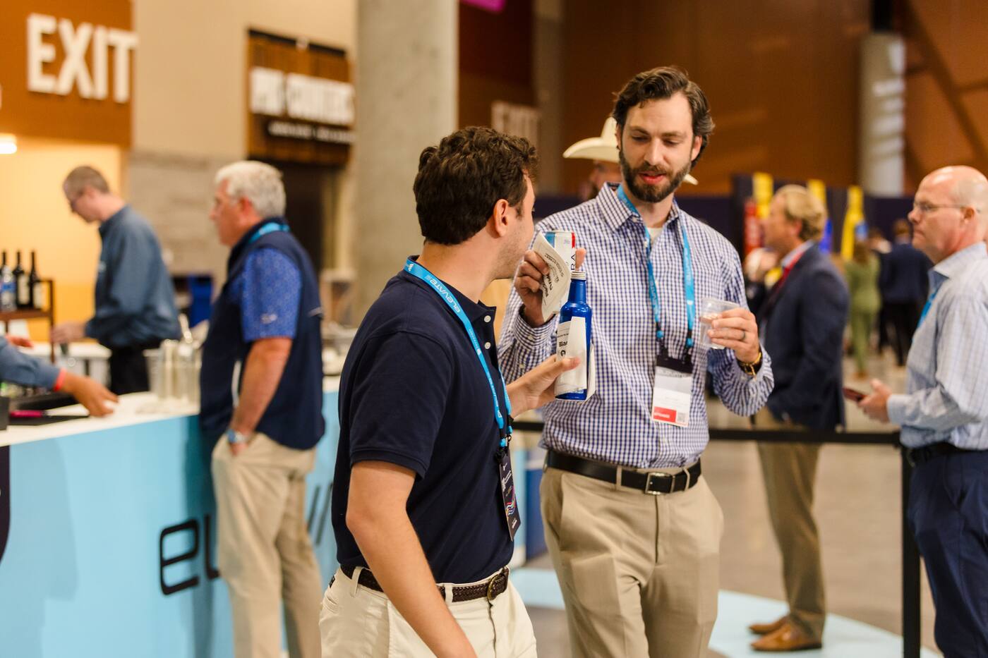 Attendees talking near an event exit