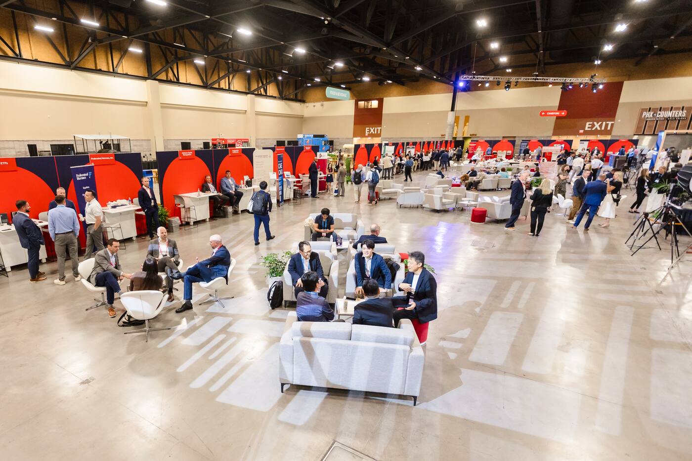 A wide view of the sponsor and expo area