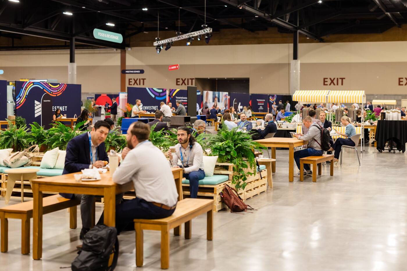 Guests working and meeting in an event lounge