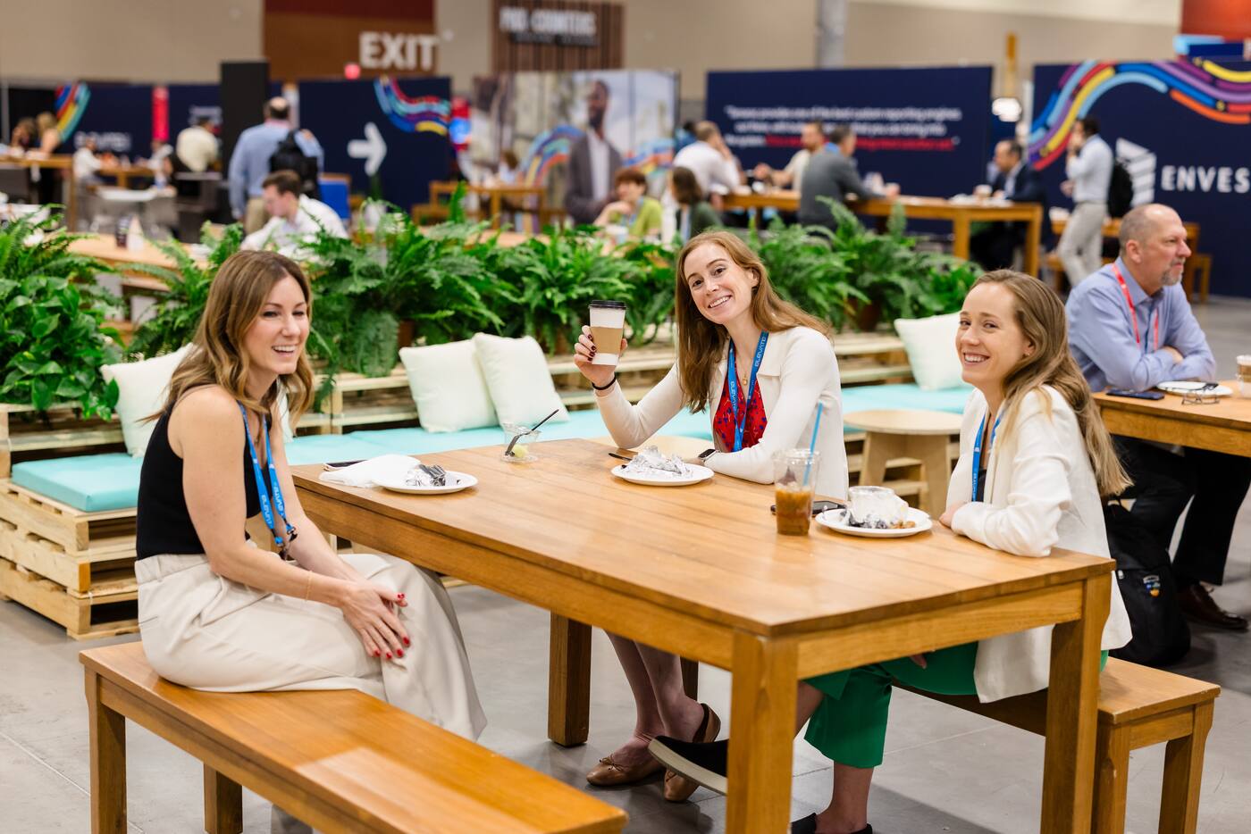 Attendees talking around tables