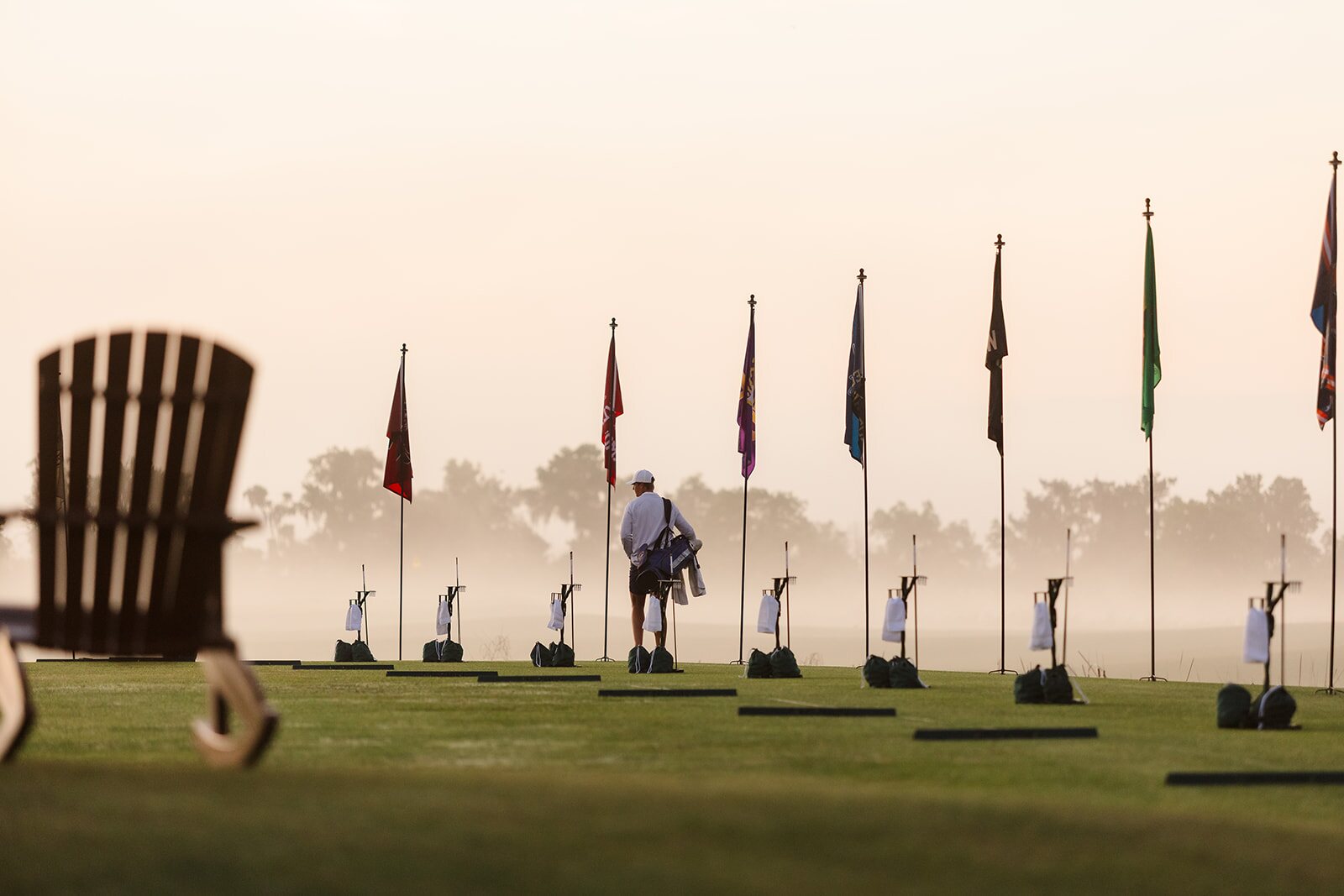 Range player warming up beside flags at The Ford Collegiate